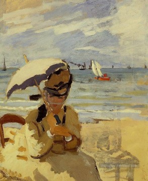 ville Tableaux - Camille Assis sur la plage à Trouville Claude Monet